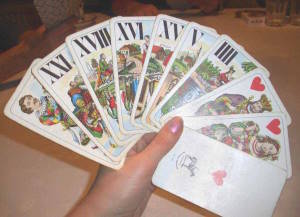 Tarot player with Austrian Tarot cards (Industrie und Glück pattern) during a game. Wikimedia Commons, Attribution-ShareAlike 3.0 Unported.